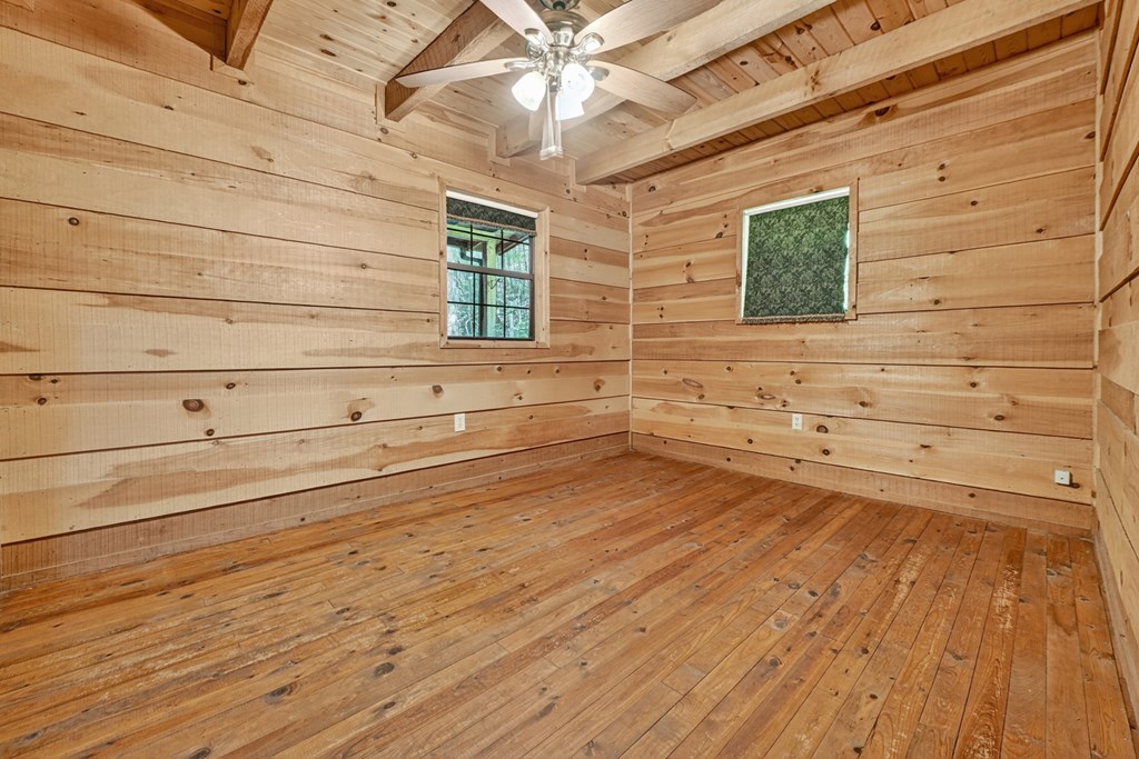 28.65 Jolley Way Epworth, GA 30541 - Photo 15 of 55 a view of a livingroom with an empty space & wooden floor