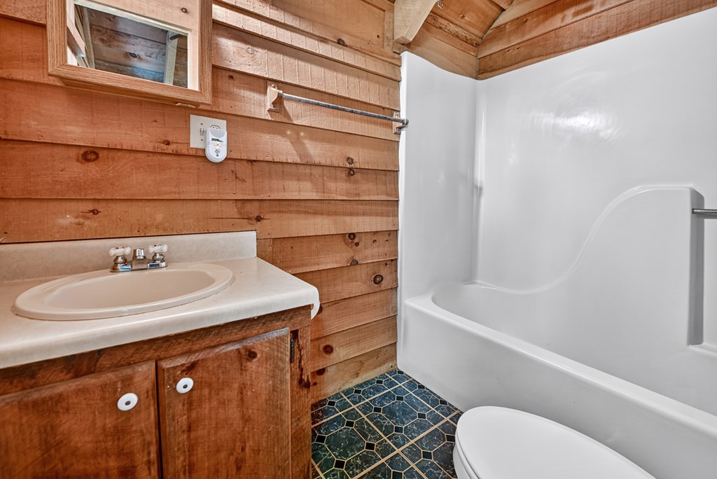 28.65 Jolley Way Epworth, GA 30541 - Photo 23 of 55 a bathroom with a sink toilet and shower