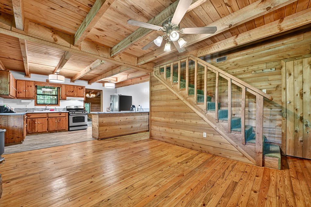 28.65 Jolley Way Epworth, GA 30541 - Photo 9 of 55 a view of a kitchen with wooden floors and a sink