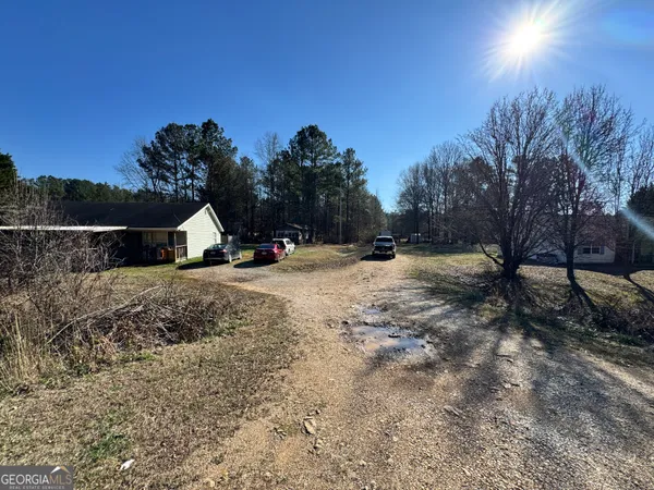 a view of the house with a yard