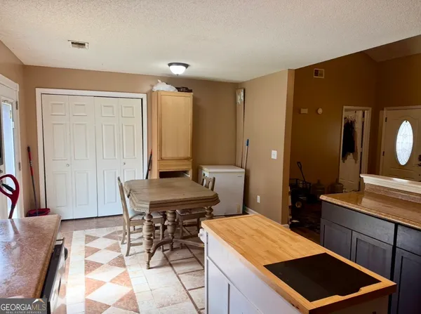 a room with a table and chairs