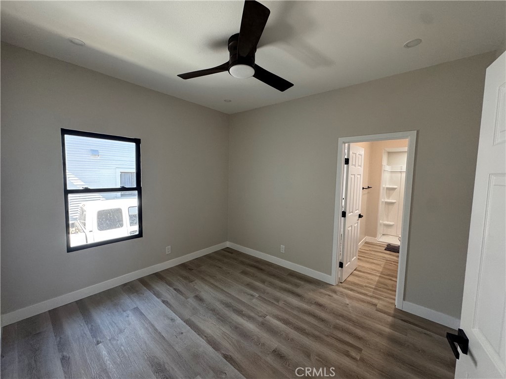 529 West 10th Street Long Beach, CA 90813 - Photo 11 of 19 a view of an empty room with wooden floor and a window