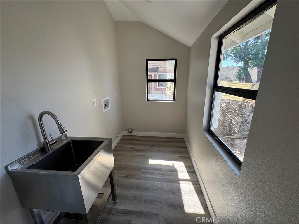 529 West 10th Street Long Beach, CA 90813 - Photo 12 of 19 a kitchen that has a sink and a large window