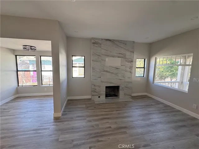a view of a kitchen with a sink and cabinets