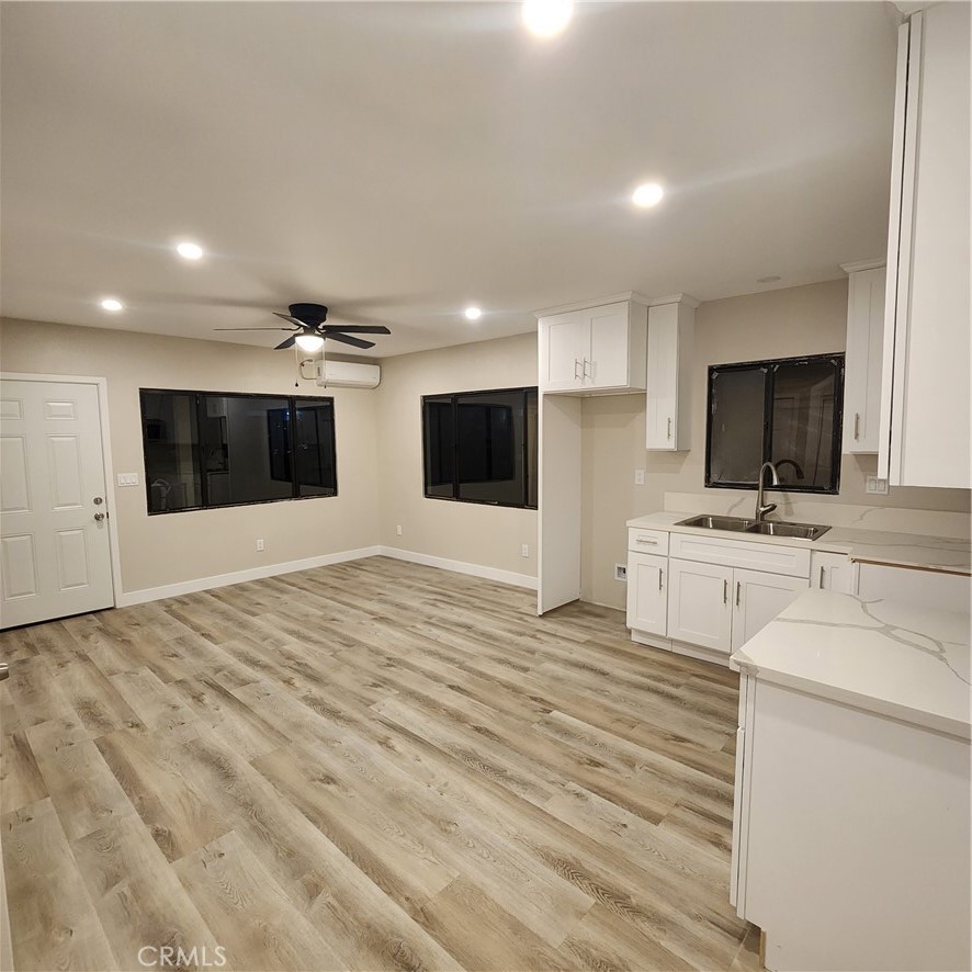 529 West 10th Street Long Beach, CA 90813 - Photo 16 of 19 a view of a kitchen with stainless steel appliances kitchen island sink and cabinets