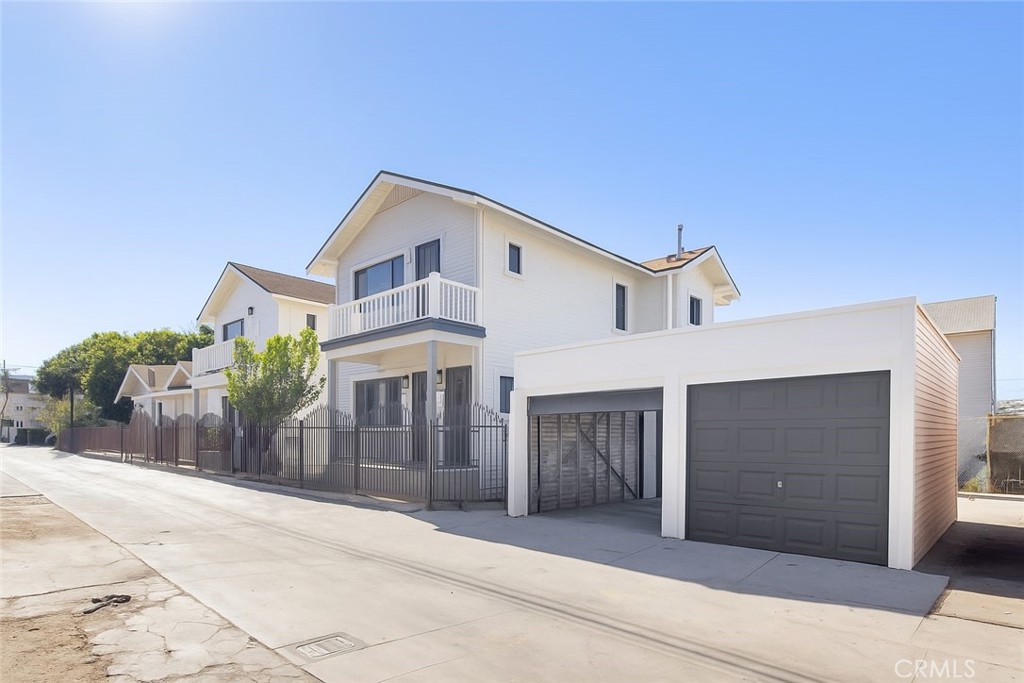 529 West 10th Street Long Beach, CA 90813 - Photo 6 of 19 a front view of a house with a garage and balcony