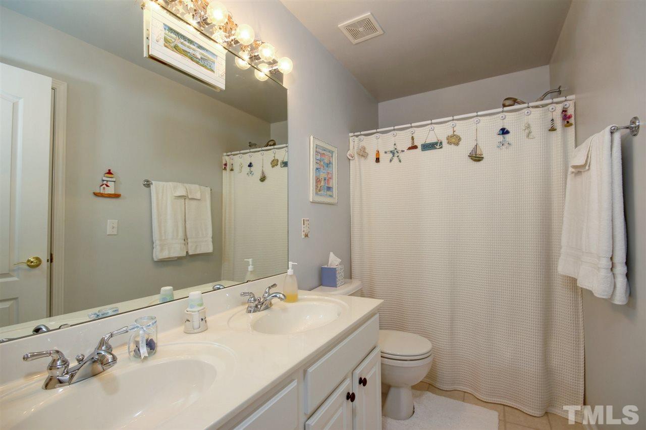 5427 Brandy Bay Road Raleigh, NC 27613 - Photo 15 of 25 Lots of counter space here and storage space! Double vanity , garden tub, glass enclosed shower, separate water closet and HUGE walk in closet with shelving. Also a linen closet for storage.