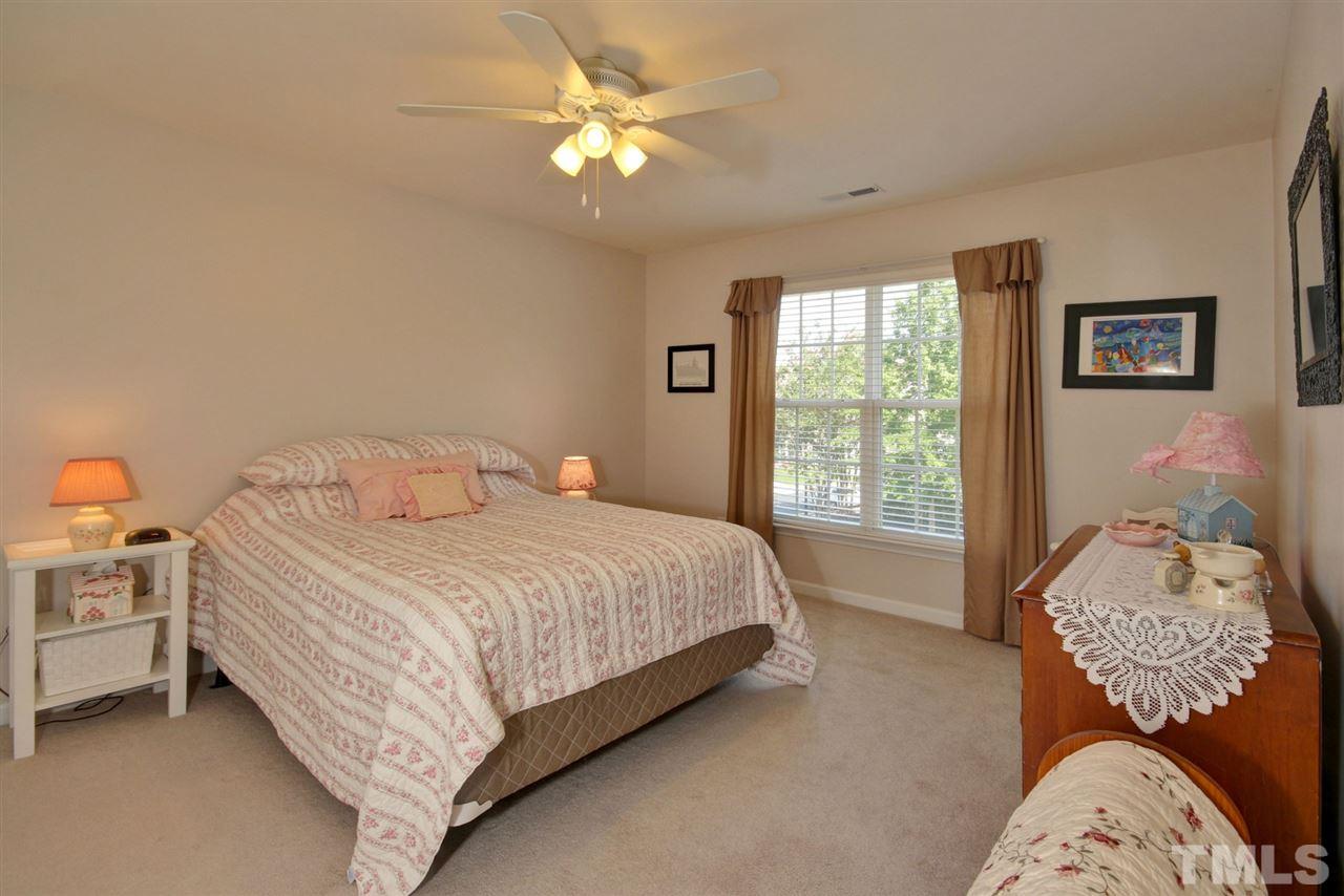 5427 Brandy Bay Road Raleigh, NC 27613 - Photo 20 of 25 3rd bedroom. Very spacious with ceiling fan, big walk in closet and pristine carpet.