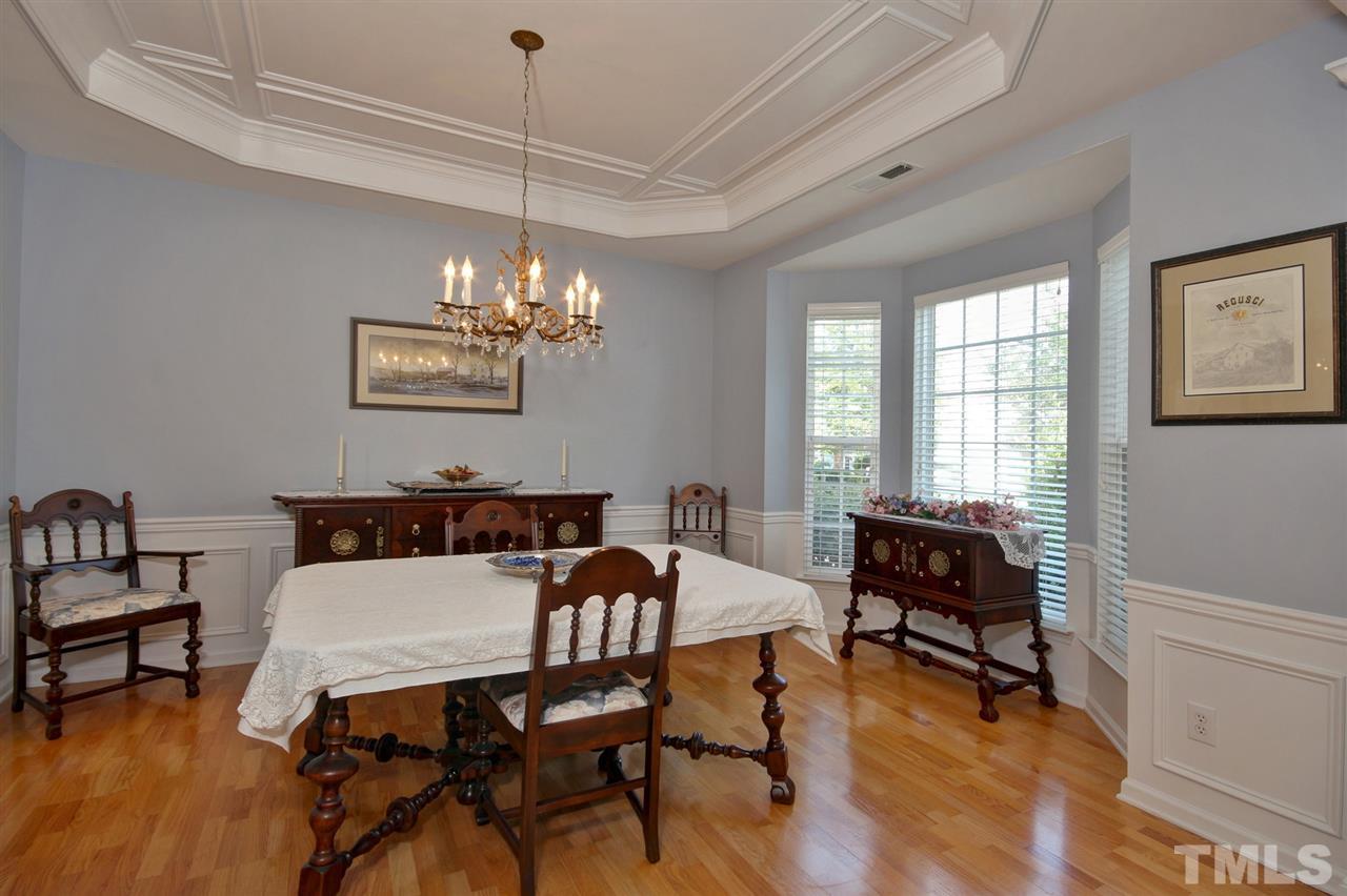 5427 Brandy Bay Road Raleigh, NC 27613 - Photo 4 of 25 Elegant dining room is great for hosting friends, family and new neighbors over for a dinner party! Stunning Bay window, wainscoting and a tray ceiling enhance your dining room.
