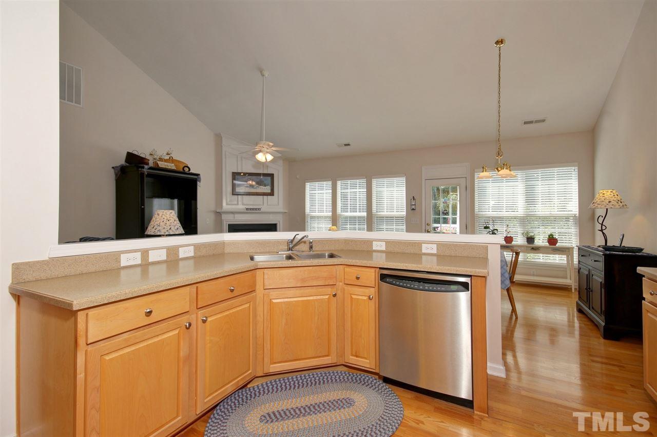 5427 Brandy Bay Road Raleigh, NC 27613 - Photo 8 of 25 Never miss a moment while entertaining in this very large kitchen so open and inviting! Additional upgrades include a gas range, griddle and warming drawer along with the stainless steel appliances and Corian counter tops.