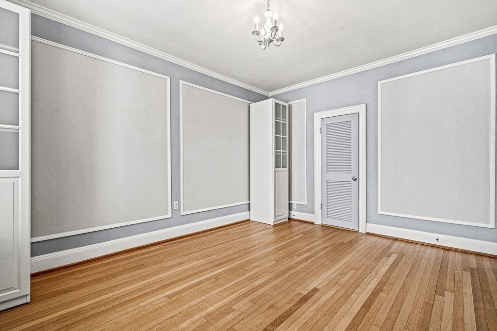 6 Lanark Road, Unit 4 Brookline, MA 02445 - Photo 18 of 23 a view of an empty room with wooden floor