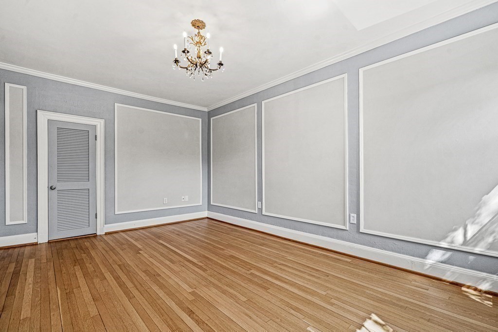 6 Lanark Road, Unit 4 Brookline, MA 02445 - Photo 20 of 23 a view of an empty room with wooden floor