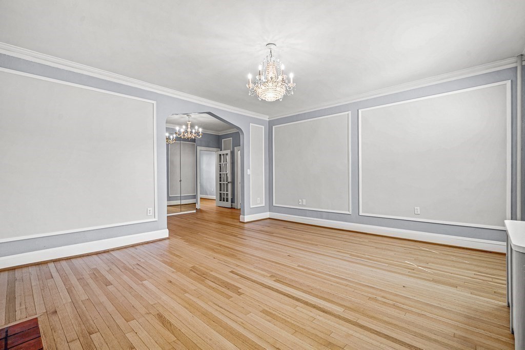 6 Lanark Road, Unit 4 Brookline, MA 02445 - Photo 8 of 23 a view of an empty room with wooden floor