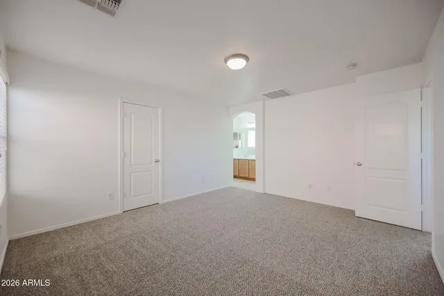 a view of an empty room and window