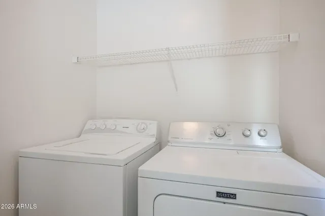 a utility room with dryer and washer