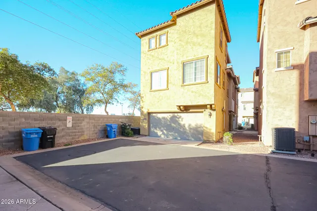 a view of a house with a street