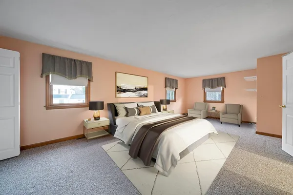 a bed room with two beds and a window