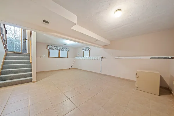 a view of an empty room with a windows