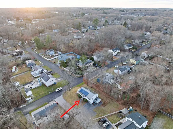 an aerial view of residential houses with outdoor space