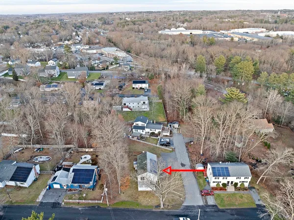 an aerial view of residential houses with outdoor space