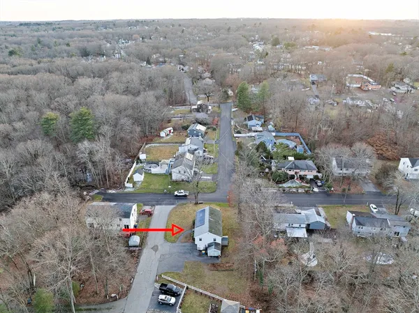an aerial view of residential houses with outdoor space