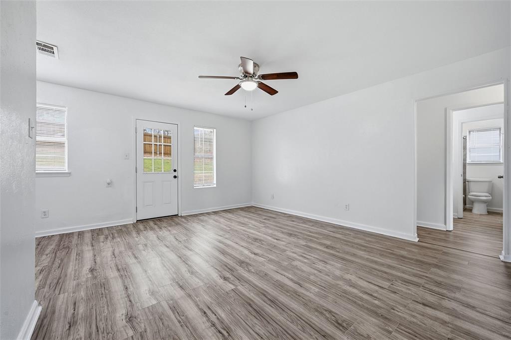 629 Chambers Street Denton, TX 76205 - Photo 3 of 17 Vinyl flooring throughout.