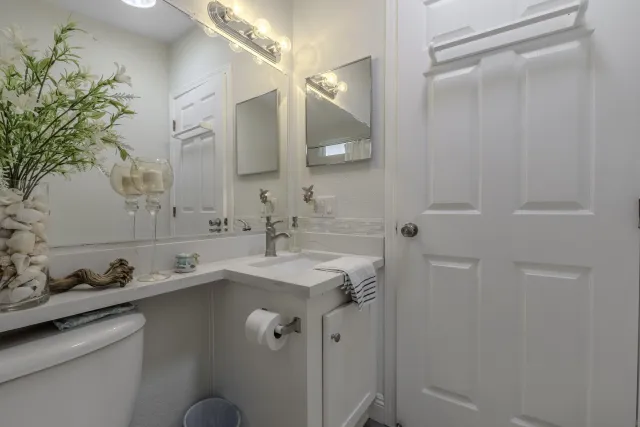 a bathroom with a sink and mirror