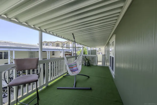 a view of a porch with furniture