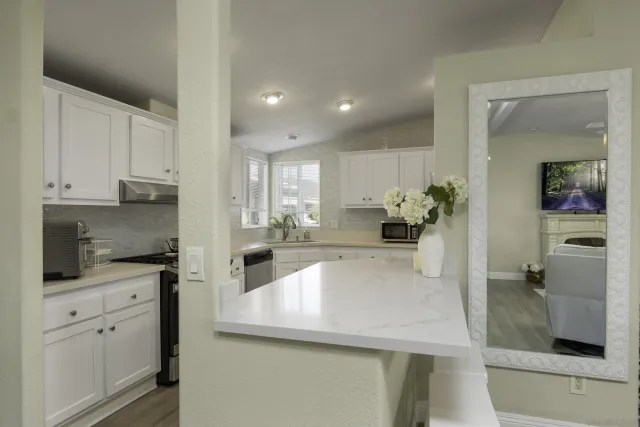 a kitchen with counter top space and cabinets