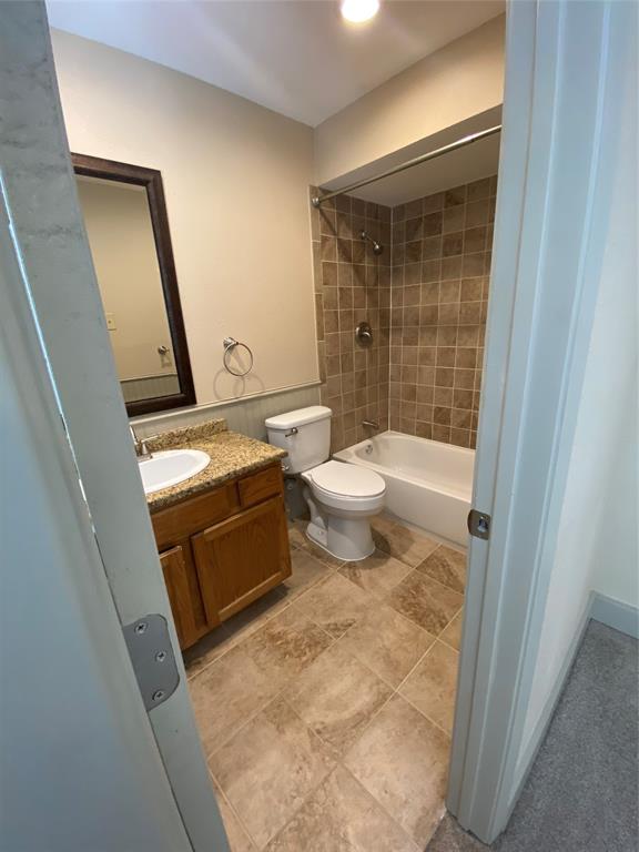 7720 Kings Ridge Road Frisco, TX 75035 - Photo 14 of 16 a bathroom with a toilet a sink and a shower
