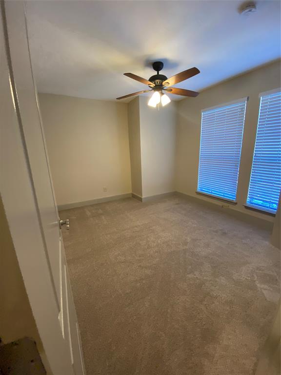 7720 Kings Ridge Road Frisco, TX 75035 - Photo 15 of 16 an empty room with windows and fan