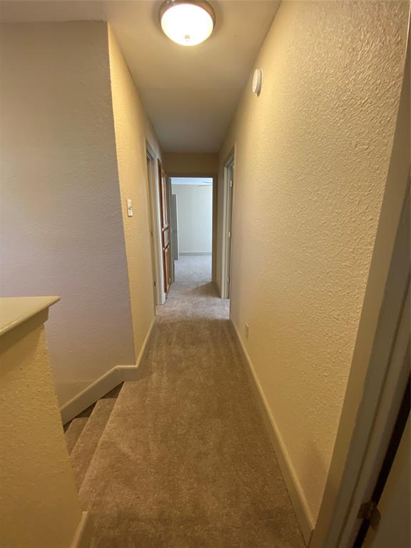 7720 Kings Ridge Road Frisco, TX 75035 - Photo 16 of 16 a view of a hallway with wooden floor