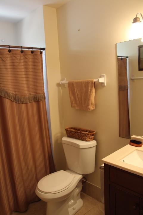 22272 Timberly Drive Boca Raton, FL 33428 - Photo 4 of 7 a bathroom with a toilet a sink and a mirror
