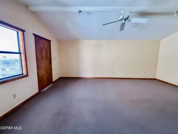 a view of a house with snow on the road