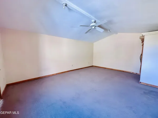 a view of a kitchen with a sink and cabinets