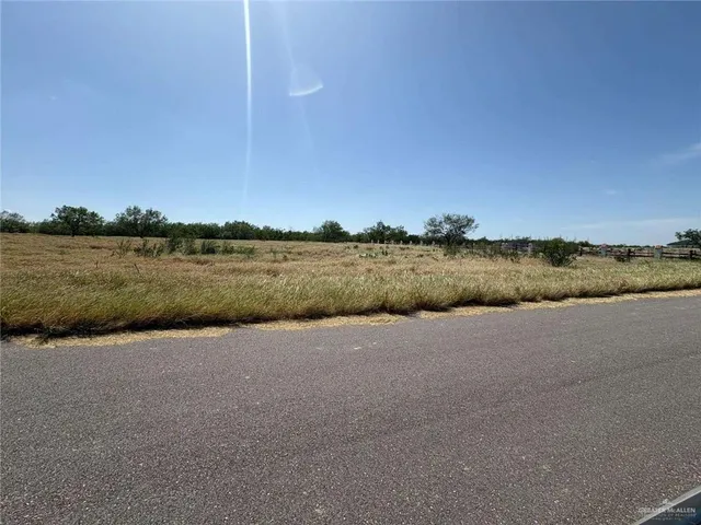 a view of a lake with houses in background