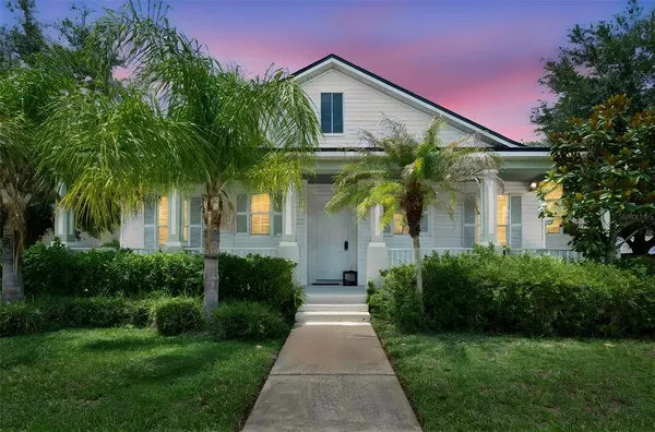 a front view of house with yard and green space