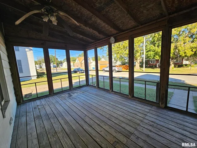 a view of a house with a yard and tree