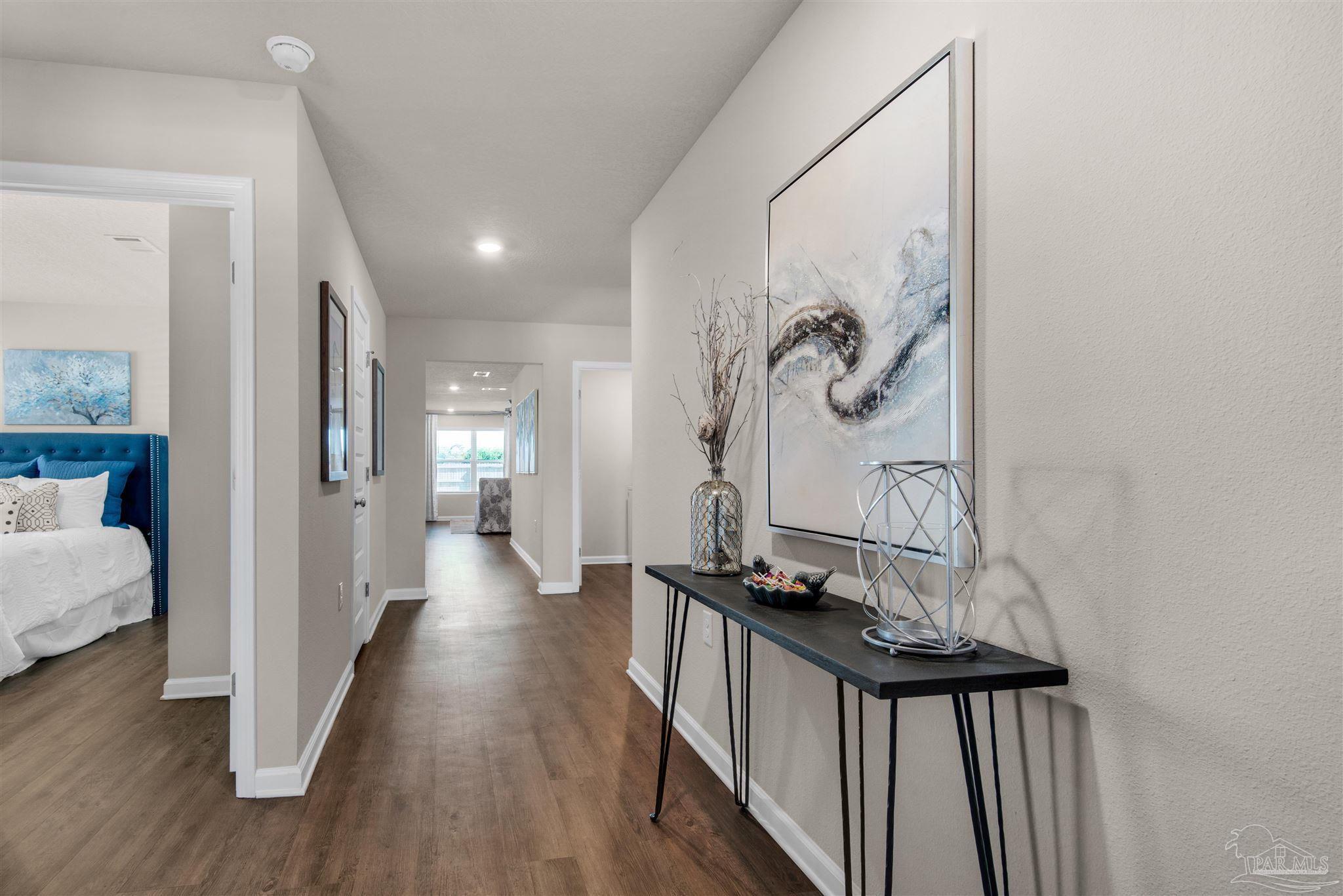 5213 Conservation Circle Pace, FL 32571 - Photo 12 of 13 a view of a hallway with wooden floor