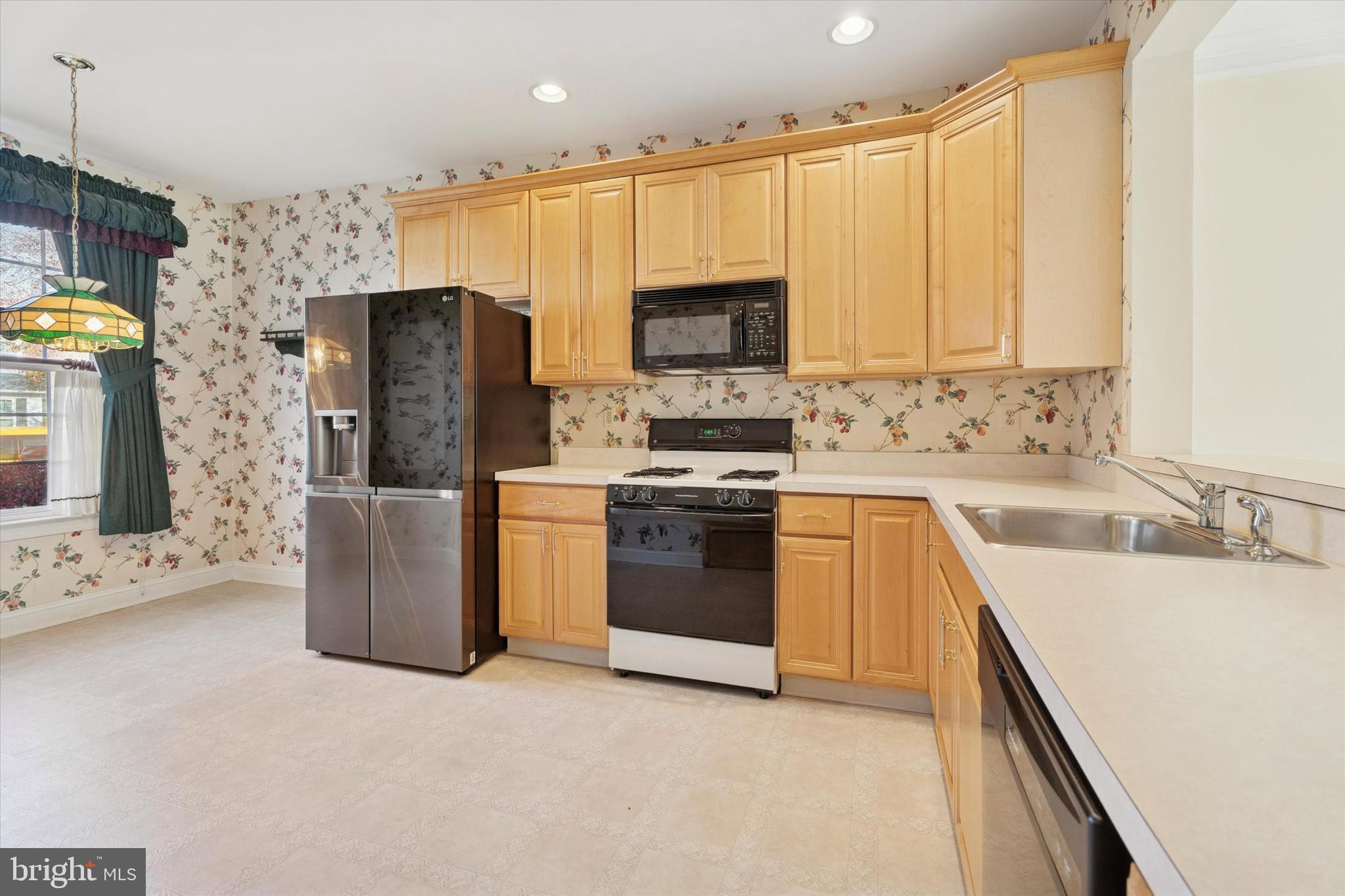 416 Ruth Court Harleysville, PA 19438 - Photo 12 of 35 a kitchen with stainless steel appliances a refrigerator sink and microwave
