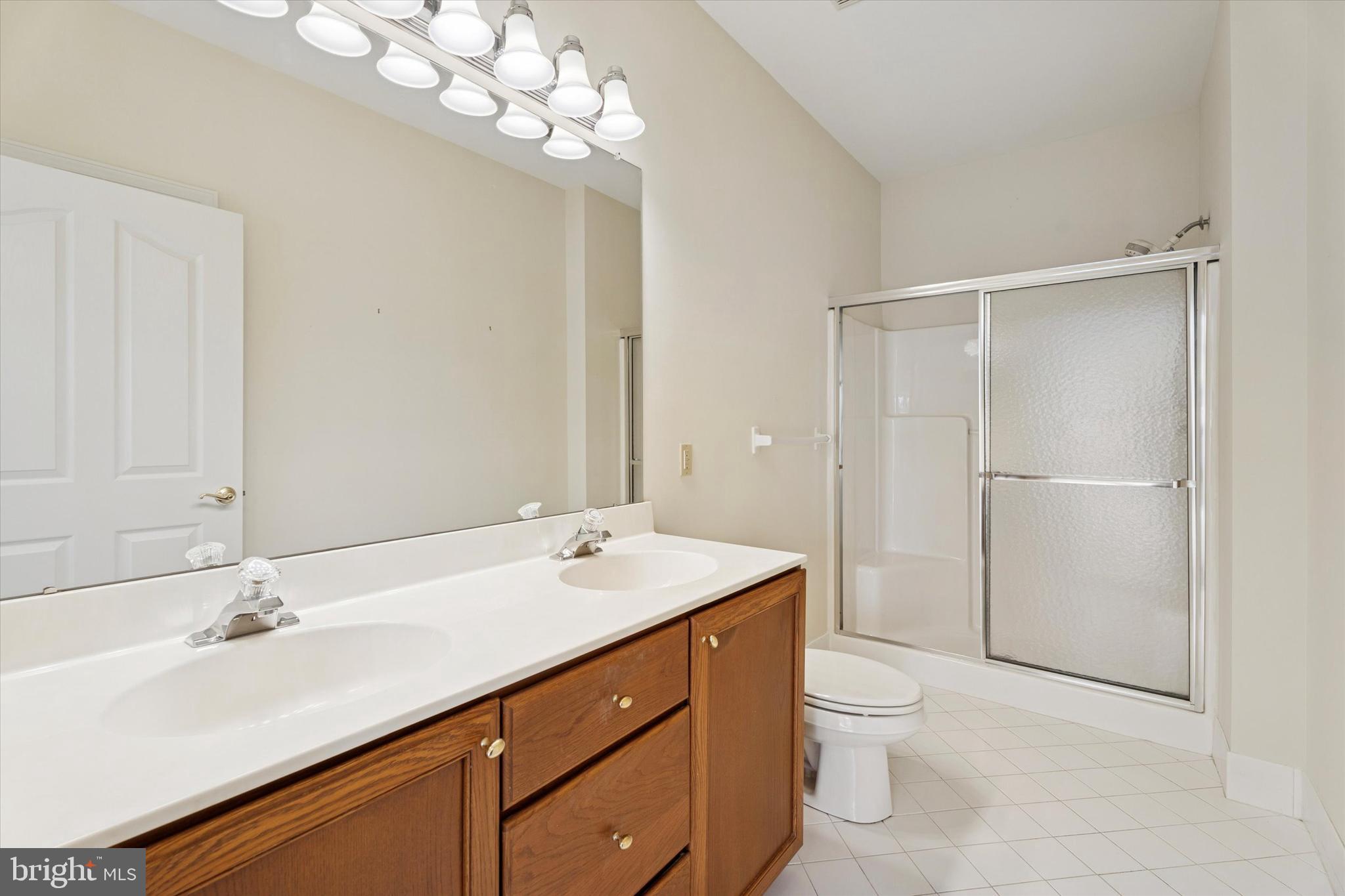 416 Ruth Court Harleysville, PA 19438 - Photo 23 of 35 a bathroom with a sink a toilet and shower