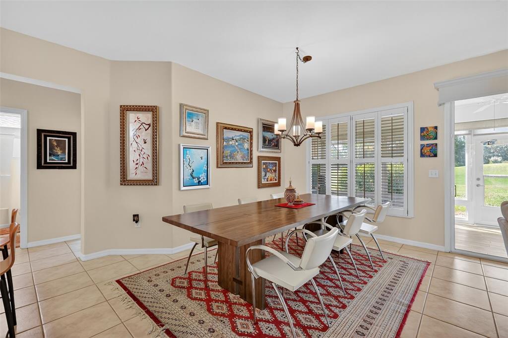13536 Southeast 97th Terrace Road Summerfield, FL 34491 - Photo 14 of 34 a view of a dining room with furniture window and wooden floor