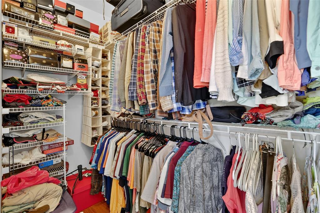 13536 Southeast 97th Terrace Road Summerfield, FL 34491 - Photo 19 of 34 a view of walk in closet with clothes and shoes