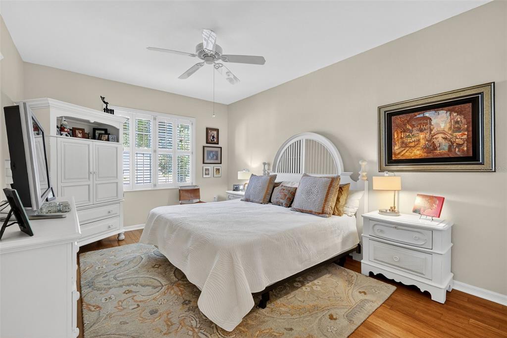 13536 Southeast 97th Terrace Road Summerfield, FL 34491 - Photo 20 of 34 a bedroom with a bed wooden floor and window