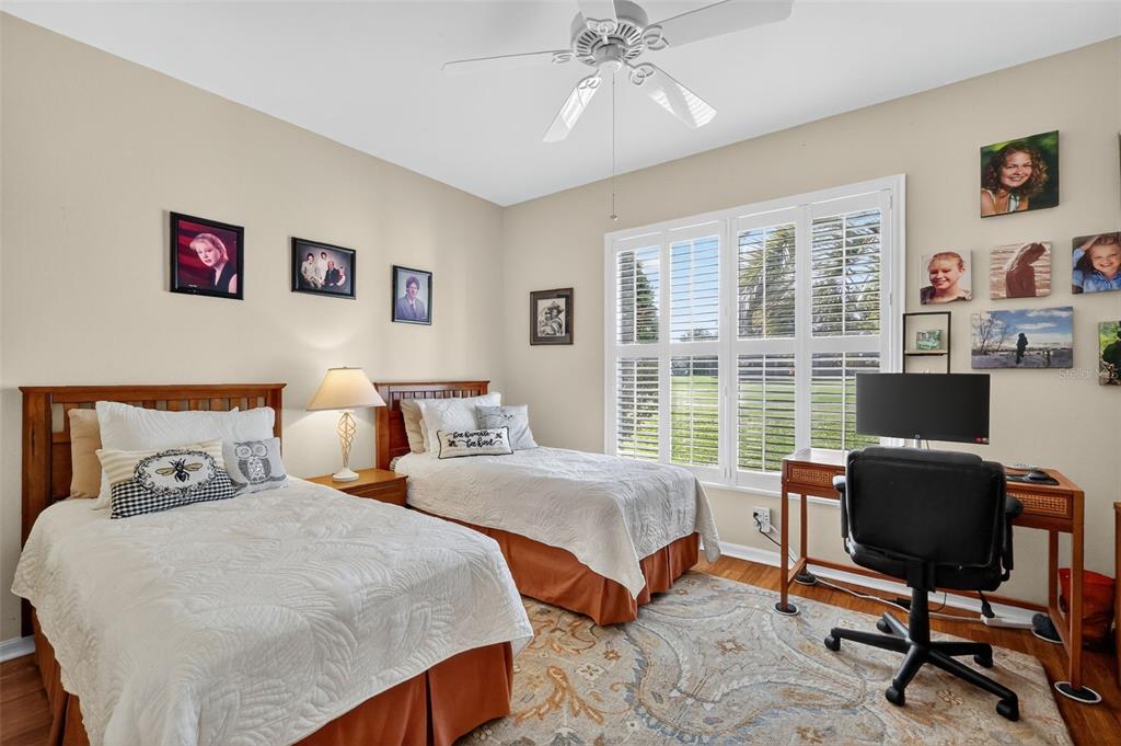 13536 Southeast 97th Terrace Road Summerfield, FL 34491 - Photo 22 of 34 a bedroom with two beds and a desk