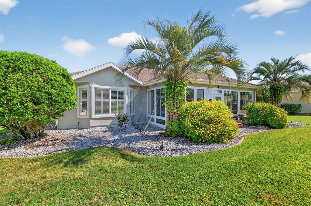 13536 Southeast 97th Terrace Road Summerfield, FL 34491 - Photo 27 of 34 a view of a house with a yard and plants