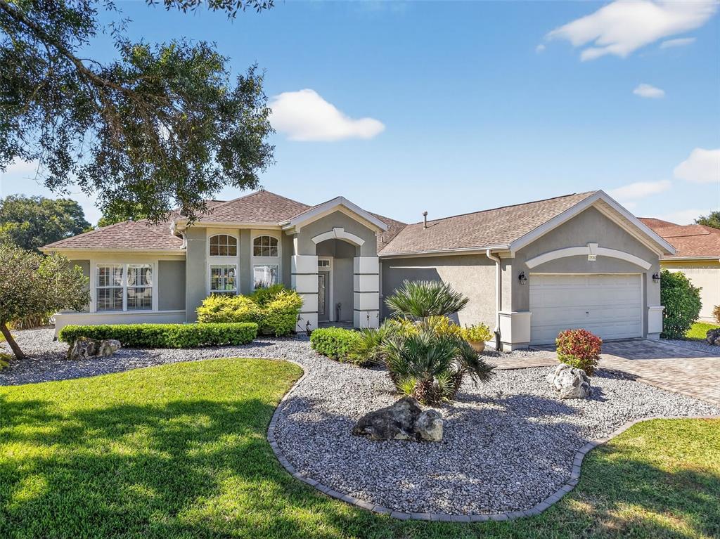 13536 Southeast 97th Terrace Road Summerfield, FL 34491 - Photo 34 of 34 a front view of a house with garden