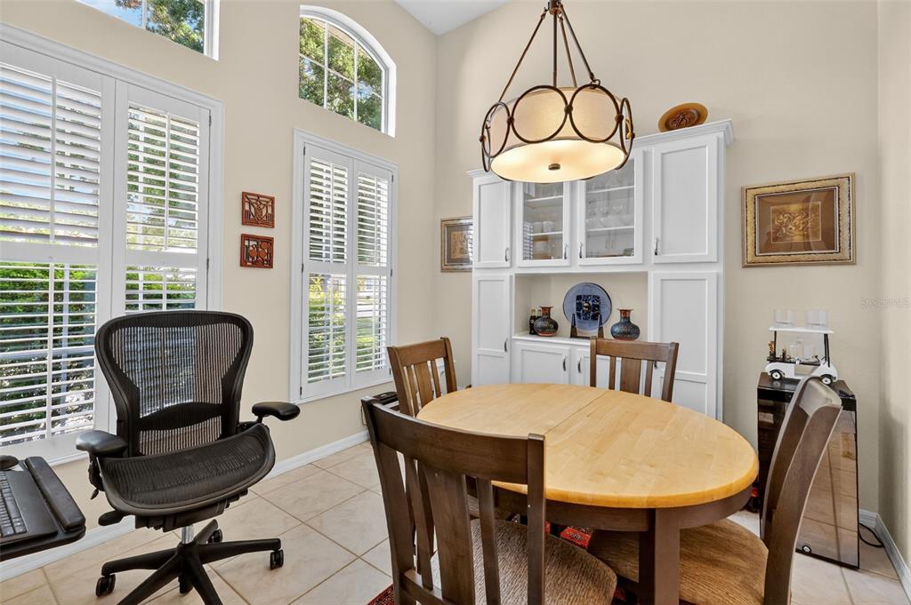 13536 Southeast 97th Terrace Road Summerfield, FL 34491 - Photo 10 of 34 a view of a dining room with furniture window and outside view