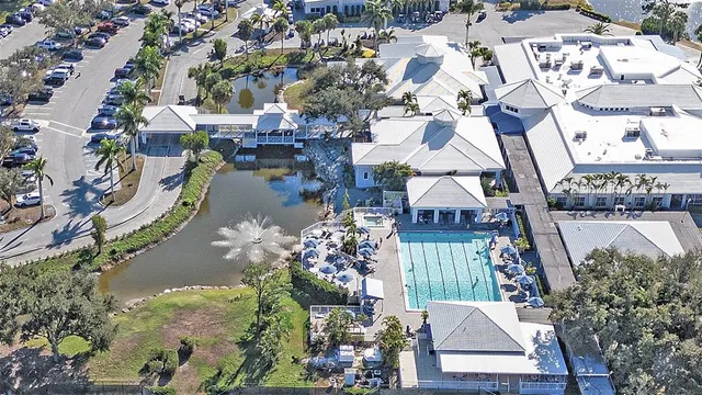a bathroom with a granite countertop sink mirror vanity and toilet