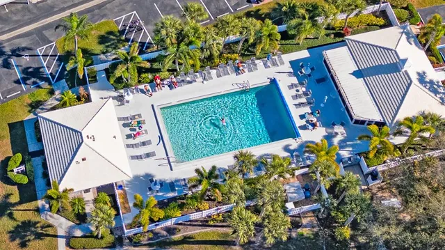 an aerial view of a house with a swimming pool